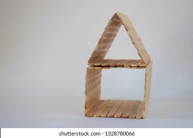 Popsicle Stick House On A White Background