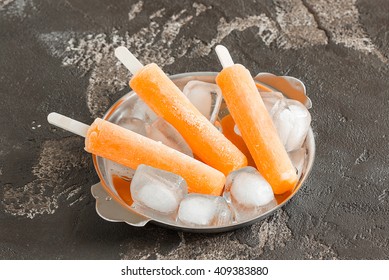 popsicles and ice on a stick on a plate