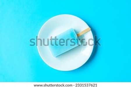 Popsicles on the light blue background.