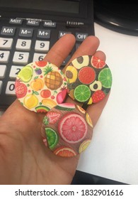 PopSocket With A Picture Of Fruit On The Girl's Hand