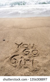 Popular 90s Slang Phrase You Go Girl Written In Sand On The Beach. Nostalgia Concept