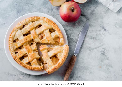 Popular American Apple Pie Piece And Cup Of Tea On Gray Table Background. Homemade Classical Friut Tart. Copy Space,top View