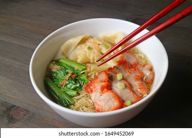 Popular Asian Dish of Roasted Pork Wonton Dumpling and Egg Noodle Soup with Vegetables