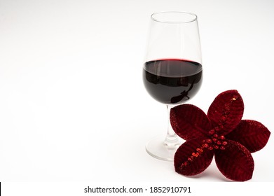 Popular British Christmas Drink, Glass Of Vintage Ruby Port Wine And Christmas Tree Decoration Close Up Isolated On White