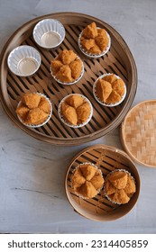 Popular Chinese pastry. Fa Gao aka Prosperity Cake. Color comes from brown sugar and the Chinese character in the red packet symbolised "prosperity"