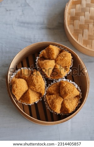 Popular Chinese pastry. Fa Gao aka Prosperity Cake. Color comes from brown sugar and the Chinese character in the red packet symbolised 