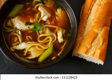 The Popular Comfort Food Of Chicken Noodle Soup A Favorite Variety With Crusty Bread