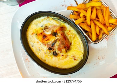 Popular dish of French cuisine is the escalope Savoyard, made from layers of meat, mushrooms, soft Reblochon cheese, ham and ..traditional cream-fresh, served with French fries