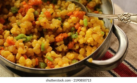 Popular Indian Colorful Sweet Known As Boondi Is Served In Gray Background. (Boondi Stock Photo)