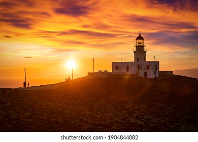 The Popular Lighthouse Armenistis On The Greek Island Of Mykonos During Sunset Time