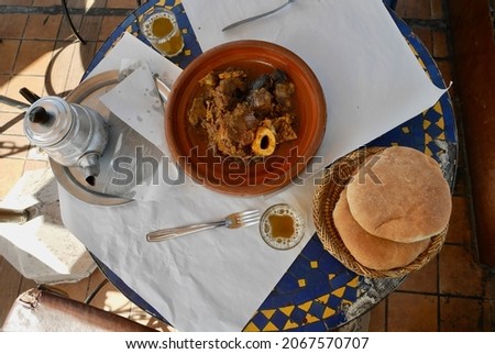 Popular local dish Tangia, Tanjia, roasted lamb in clay pots at Hammam furnace, served with bread and mint tea. Marrakech, Morocco.