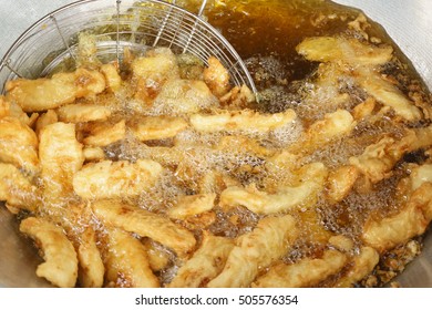 Popular Malaysian Fried Banana In Oil.Oily Food Made From Banana Mix With White Flour And Serve With Kitchup Source And Known As 