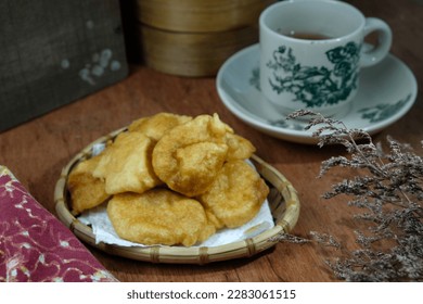 Popular Malaysian fritter snack deep fried banana balls or locally known as Cekodok Pisang , seletive focus - Shutterstock ID 2283061515