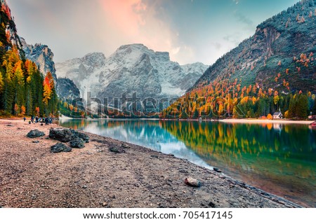 Popular photographers attraction of Braies Lake. Colorful autumn landscape in Italian Alps, Naturpark Fanes-Sennes-Prags, Dolomite, Italy, Europe. Beauty of nature concept background.
