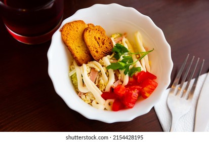 Popular Russian Salad Of Napa Cabbage, Ham And Boiled Eggs Dressed With Light Mayo Traditionally Served With Crispy Toasts.