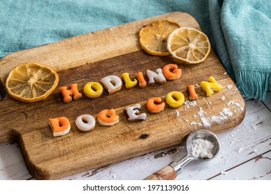 Popular Saying In The Community Of Online Currency Sentence Made Out Of Yellow Orange And White Cookies On A Wooden Plate With A Measuring Spoon And A Bit Of Flour Around In Natural Light