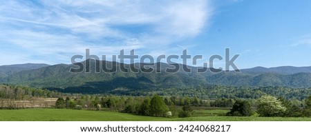 A popular scenic drive along the  Cades Cove Loop Road offers a breathtaking panoramic view of the valley and mountains in the Great Smoky Mountains National Park. Photographed in spring. 