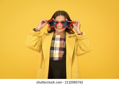 Popular schoolgirl. Carnival costume famous celebrity. Rock star. Cool kid star shaped sunglasses. Star concept. Fame and popularity. Party holiday celebration. Cheerful girl wear eyeglasses for fun