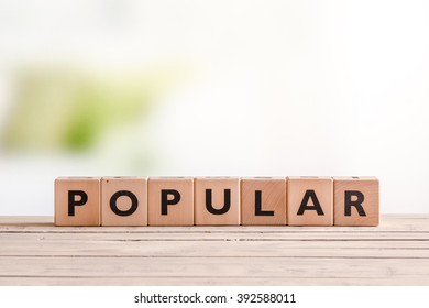 Popular sign made of cubes on a table with planks - Shutterstock ID 392588011