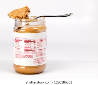 Popular Snack For Kids Of Peanut Butter In A Plastic Jar With Nutritional Facts On The Label