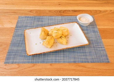 Popular Spanish Tapa Of Cod Battered With Chives And Mayonnaise Sauce For Dipping