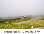 A popular winding high alpine road disappearing into the clouds. Grossglockner High Alpine Road in the Hohe Tauern National Park, Austria