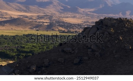 Population and forest between mountains, peak, blue sky, clouds, natural view, beautiful scenery a mountain with a large number of rocks on it 