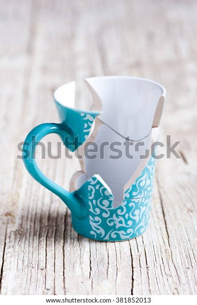 porcelain cup\
broken into pieces and stuck\
again