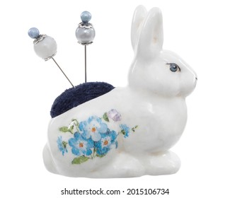 Porcelain figurine of a hare, needle bed for needlework, isolated on white background