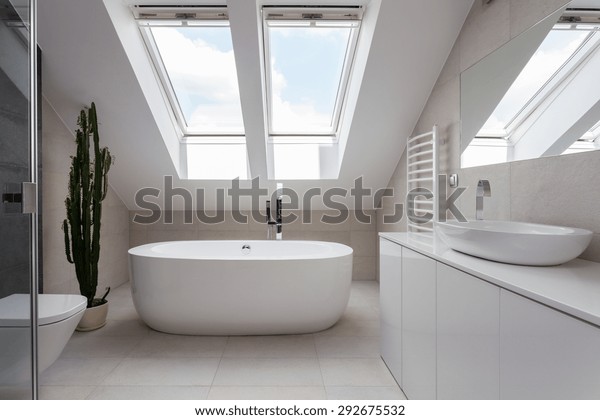 Porcelain\
freestanding bath in designed white\
bathroom