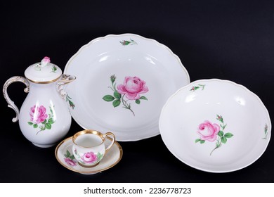Porcelain set with floral pattern, home kitchenware objects made of composition on black background, antique porcelain set buying now.  - Shutterstock ID 2236778723