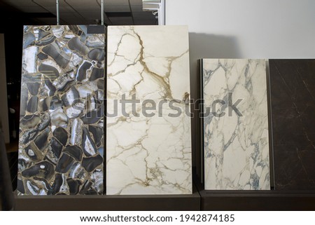 Porcelain stoneware with a high-resolution natural stone texture. A combination of two types of stoneware slabs with a natural stone pattern. White marble with veins and natural agate geode.