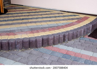 Porch Of A House Lined With Colorful Paving Stones Red And Browm