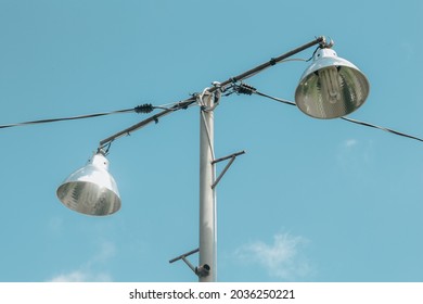 The Porch Light Of The House In The Photo From Below Towards The Blue Sky