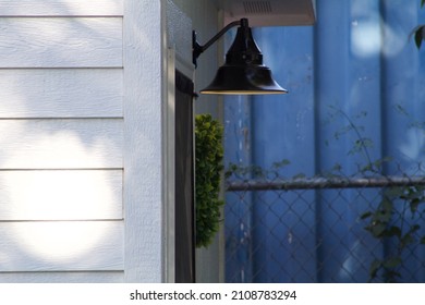 Porch Light Outside White Farm House