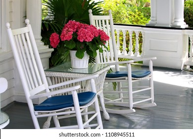 Porch With Rocking Chairs And Flowers