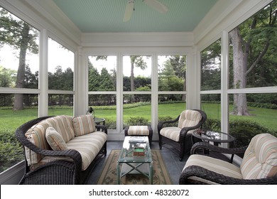 Porch in suburban home with wicker furniture