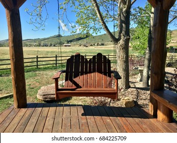 Porch Swing In Tranquil Covered Porch Rustic Country Setting