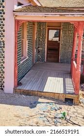 Porch Of Unique Bottle House In Desert Ghost Town