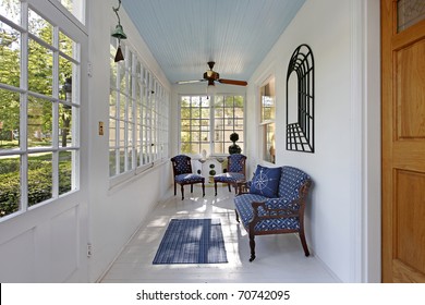 Porch With Wall Of Windows And Blue Ceiling