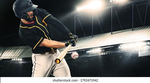 Porfessional baseball player with bat taking a swing on grand arena. Ballplayer on stadium in action.