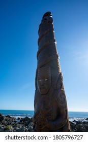 Porirua / New Zealand - July 26 2020: Maori Carving Pou Tangaroa Standing In Pukerua Bay