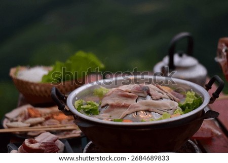 Pork BBQ with mountain view, Pork BBQ dinner with mountain view, cooking and eating Moo Kata, Thai barbecue grill pork with mountain view