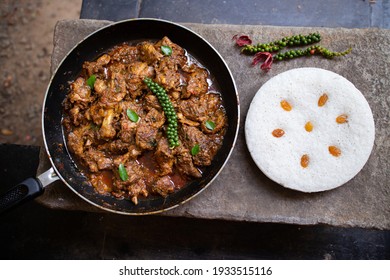 Pork Or Beef Roast Kerala Style With Vattayappam Steamed Rice Cake , Homemade Curry With Indian Spices , Asian Cuisine Spicy Meat Curry Cooked In Coconut Milk . Side Dish Christian Food Christmas