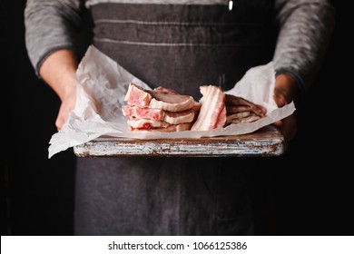 Pork belly farm fresh pork belly butcher person cutting bacon porcheta
