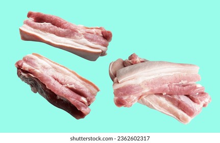 Pork belly, raw meat isolated with clipping path, no shadow in green background, cooking ingredients