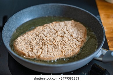 Pork chop in frying pan  - Powered by Shutterstock