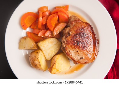 Pork Chop Stuffed With Apple With Potatoes And Carrots