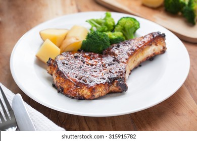 Pork Chop With Vegetable In Plate