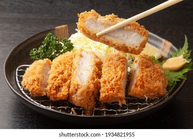 Pork cutlet and shredded cabbage on a plate